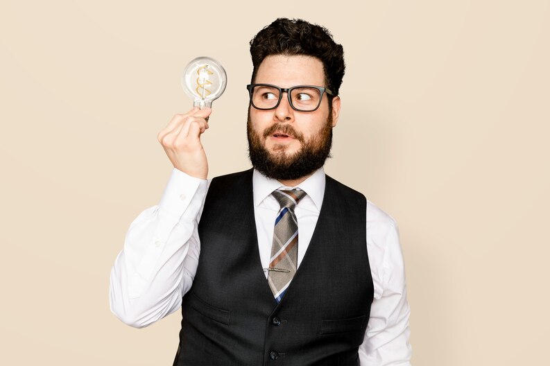 [fpdl.in]_bearded-businessman-holding-a-light-bulb-for-innovation-campaign_53876-129949_medium.jpg